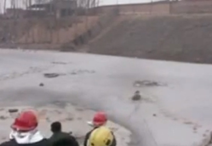 Dramatic footage of workers rescuing children from river