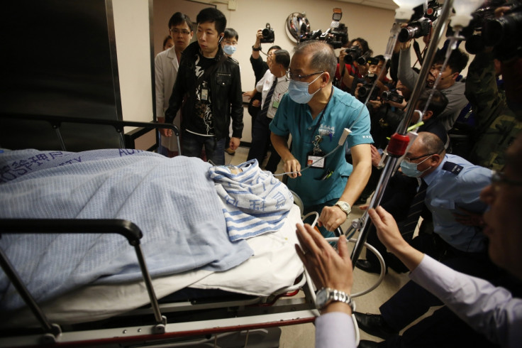 Former Ming Pao chief editor Kevin Lau Chun-to is wheeled into the operation theatre at a hospital in Hong Kong