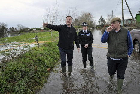 Prime Minister David Cameron announced a £10m package to help flood-hit businesses.