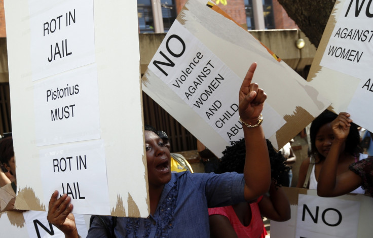 Women protest outside the Pretoria Magistrates court, during the bail application hearing of South African athlete Oscar Pistorius