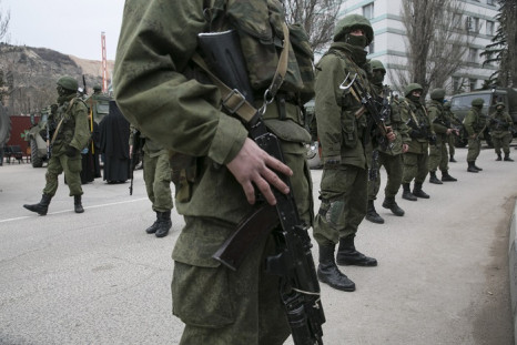 Armed troops stand guard near a Ukrainian border post in the Crimean town of Balaclava.