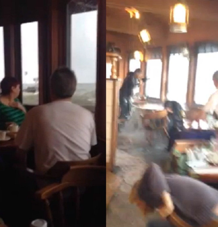 People dived for cover as the huge swell broke over the Moby Dick restaurant in California