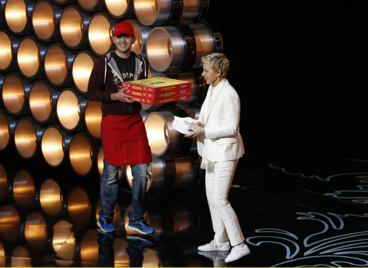 Ellen DeGeneres receives pizza from the delivery man