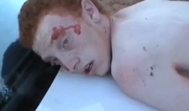 A bloodied Liam Humbles on camera after being arrested by police for killing Lewis McPherson A bloodied Liam Humbles on camera after being arrested by police for killing Lewis McPherson