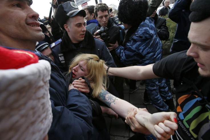 Femen protester is detained in Simferpol during protests against the annexation of the Crimea