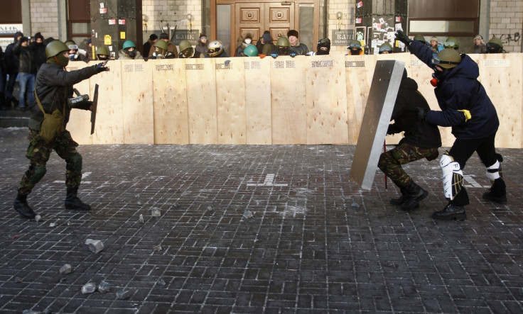 Anti-government protesters from far-right group "Right Sector" train in Independence Square in central Kiev