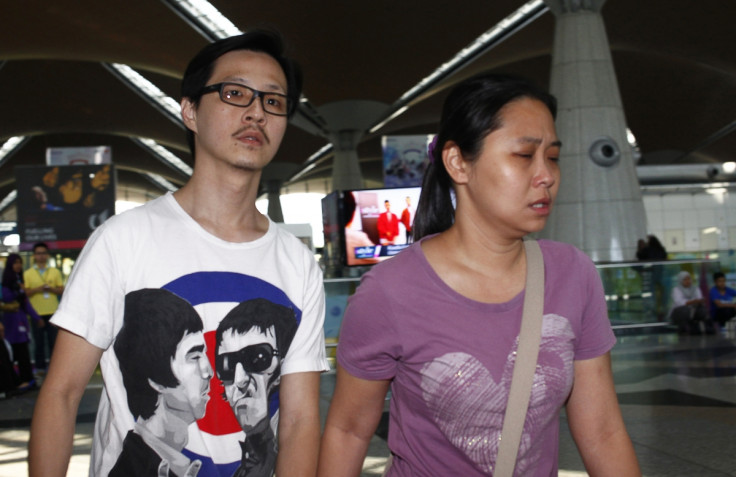 Family members of those onboard the missing Malaysia Airlines flight walk into the waiting area at Kuala Lumpur International Airport in Sepang March 8, 2014.