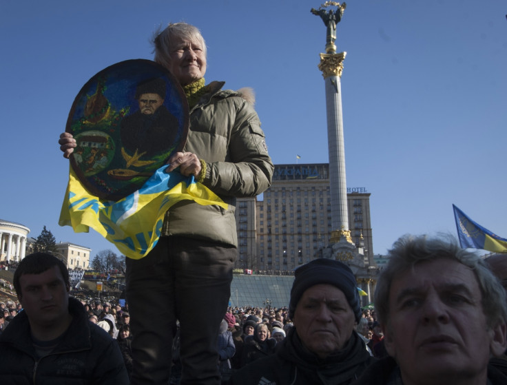A woman holds up a portrait of poet Taras Shevchenko at a pro-Ukrainian rally in Kiev.