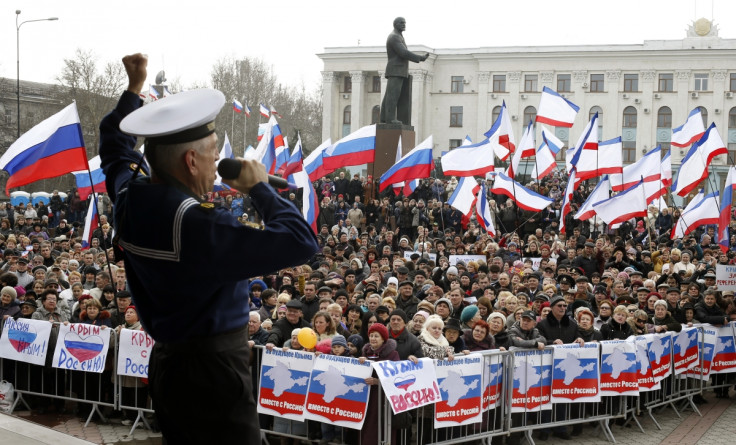 A member of Russia's Black Sea Fleet performs for the pro-Russian crowds in Simferopol, Crimea.