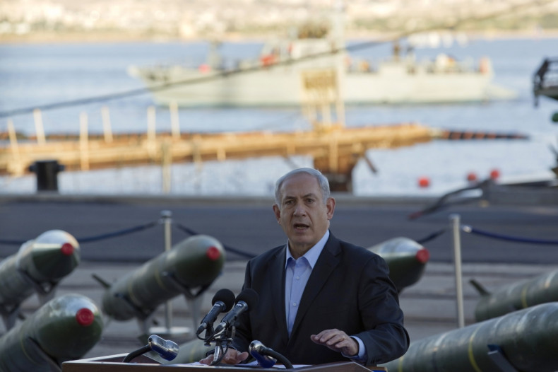 srael's Prime Minister Benjamin Netanyahu speaks to the media in front of a display of M302 rockets, found aboard the Klos C ship, at a navy base in the Red Sea resort city of Eilat