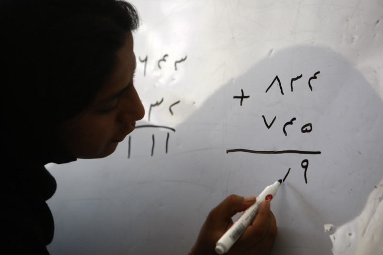 Afghan woman doing maths