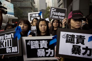 Staff members of Ming Pao newspaper take part in the march against violence on journalists in Hong Kong