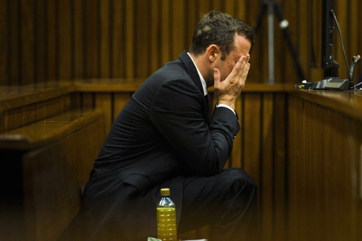 Oscar Pistorius vomited in to a bucket when he saw a graphic image of the body of Reeva Steenkamp in court today (Thursday)