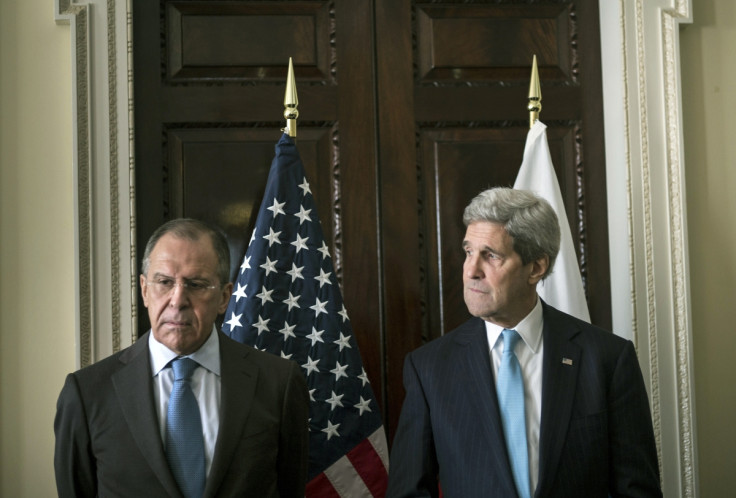 U.S. Secretary of State John Kerry (R) and Russia's Foreign Minister Sergei Lavrov stand together before their meeting at Winfield House, the home of the U.S. ambassador in London
