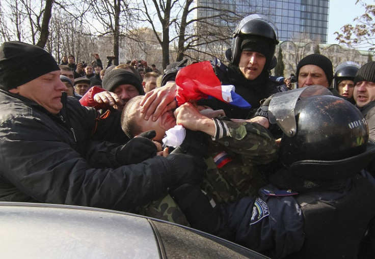 Police detain a pro-Russian protester at a rally in Donetsk.