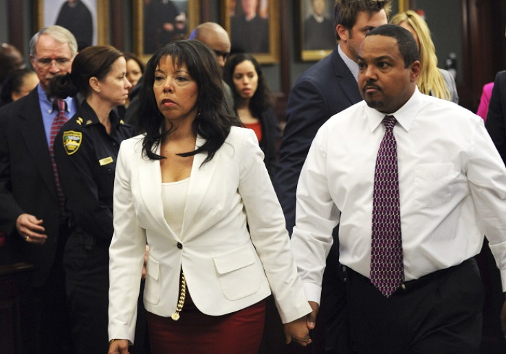 Jordan Davis' mother Lucia McBath leaves the courtroom with her husband, Curtis McBath.