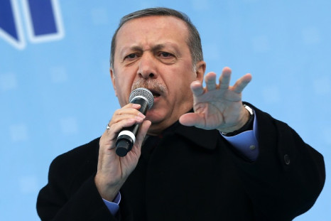 Turkish Prime Minister Recep Tayyip Erdogan addresses a crowed ahead of local elections on 30 March.