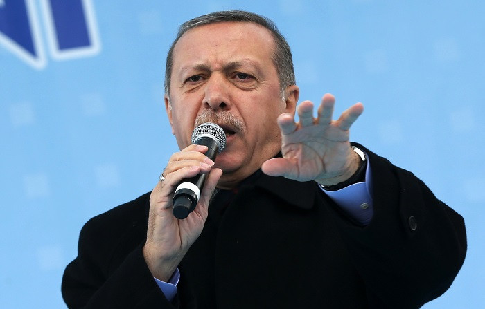 Turkish Prime Minister Recep Tayyip Erdogan addresses a crowed ahead of local elections on 30 March.