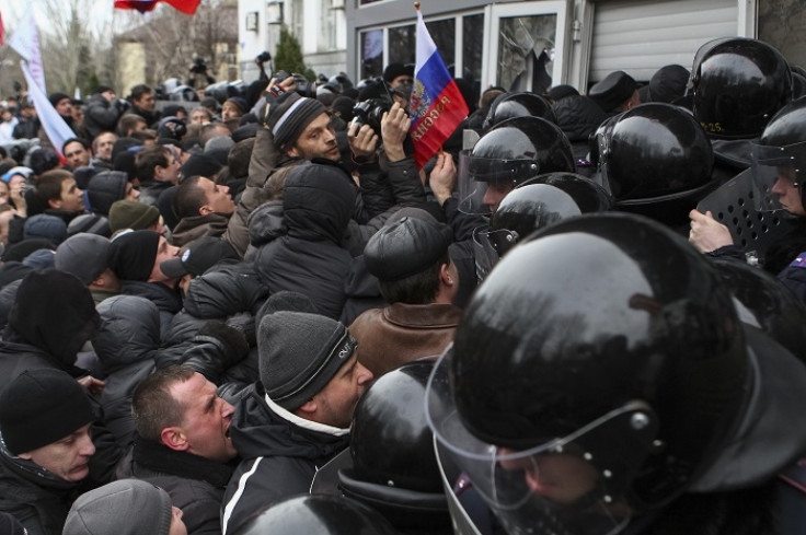 Pro-Russian demonstrators storm government buildings in Donetsk.
