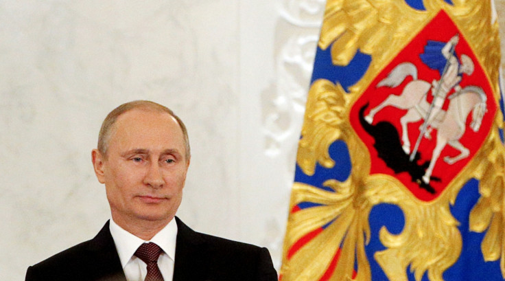 Russian President Vladimir Putin addresses the Federal Assembly, including State Duma deputies, members of the Federation Council, regional governors and civil society representatives, at the Kremlin in Moscow