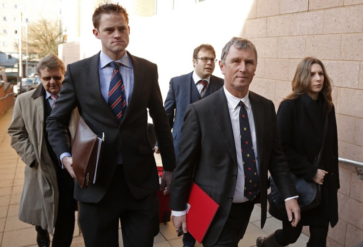 Evans arrives at Preston Crown Court for his trial with his legal team.