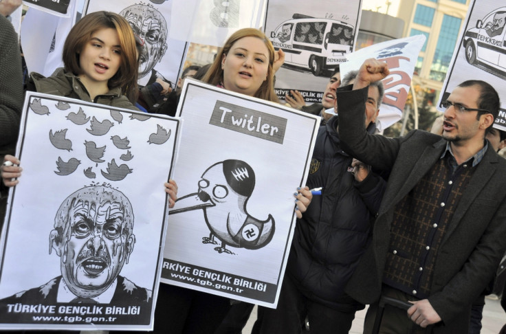 Protesters hold up placards ridiculing prime minister Recep Erdogan's Twitter ban in Ankara, Turkey on Friday, March 21.