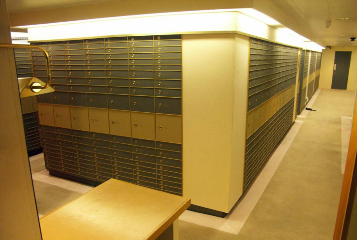 Vault of safes in Park Lane, London, were found to have stashed cash, weapons and drugs.