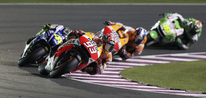 Honda MotoGP rider Marc Marquez (front) of Spain races ahead of Yamaha MotoGP rider Valentino Rossi (L) of Italy during the Qatar MotoGP Grand Prix at the Losail International circuit in Doha March 23, 2014. Honda MotoGP rider Marc Marquez (front) of Spain races ahead of Yamaha MotoGP rider Valentino Rossi (L) of Italy during the Qatar MotoGP Grand Prix at the Losail International circuit in Doha March 23, 2014.