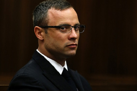 Oscar Pistorius contains his emotions as his murder trial for killing Reeva Steenkamp is adjourned in Pretoria