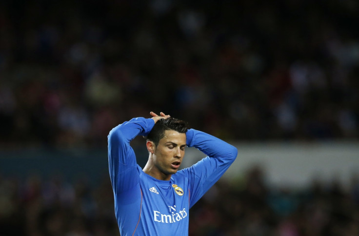 Real Madrid's Cristiano Ronaldo reacts during their Spanish First Division soccer match against Sevilla at Ramon Sanchez Pizjuan stadium in Seville March 26, 2014.