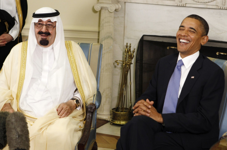 U.S. President Barack Obama (R) laughs as he meets with King Abdullah of Saudi Arabia