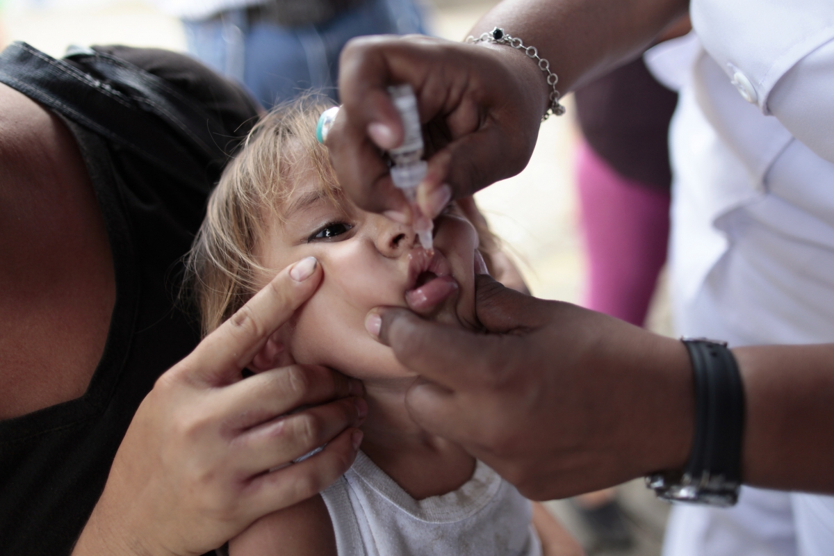 A child receives vaccination drops for Polio in Nicaragua.