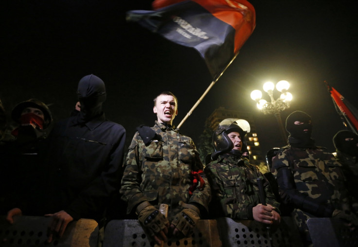 Activists of the Right Sector movement and their supporters gather outside the parliament