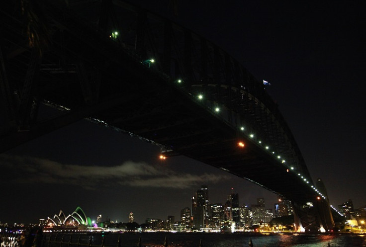 The Sydney Harbour Bridge is stripped of its usual fluorescent splendour for Earth Hour, which is now in its eighth year.