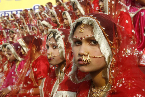 Child brides prepare for their wedding in India , where dowry deaths have risen