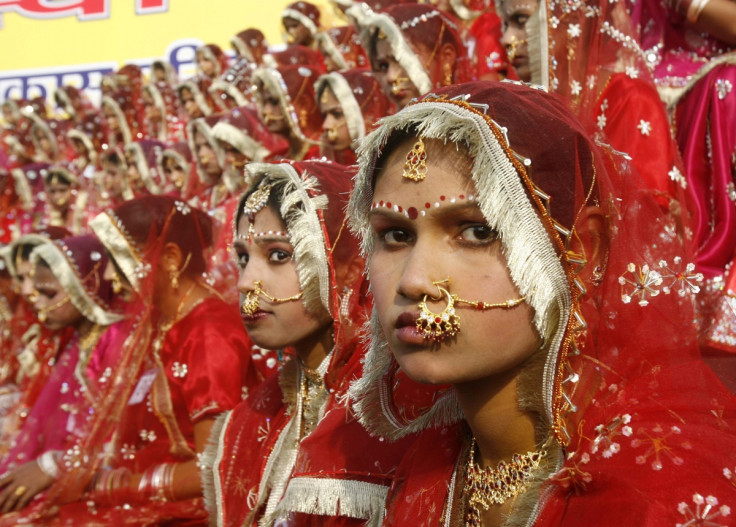 Child brides prepare for their wedding in India , where dowry deaths have risen