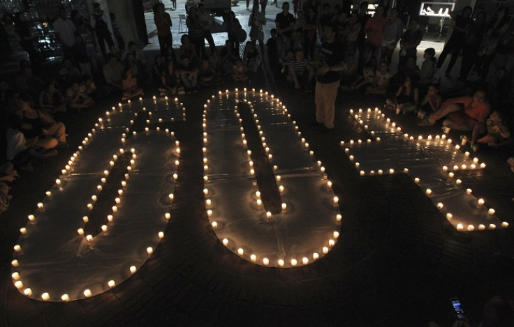Residents of the city of Cali in Colombia sit around candles to mark the annual Earth Hour event.