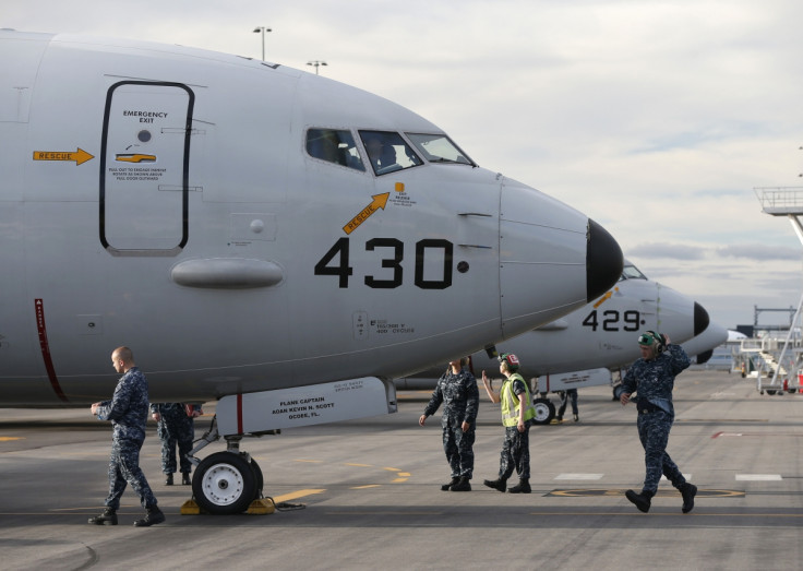 A U.S. Navy P8 Poseidon aircraft returns from a search flight for Malaysia Airlines flight MH370 over the Indian Ocean