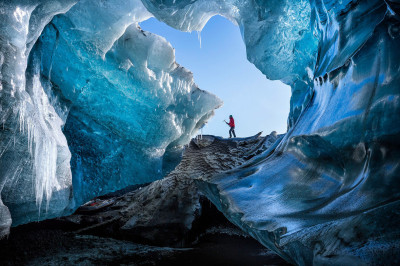 A local guide arriving at a remote ice cave in southeast Iceland