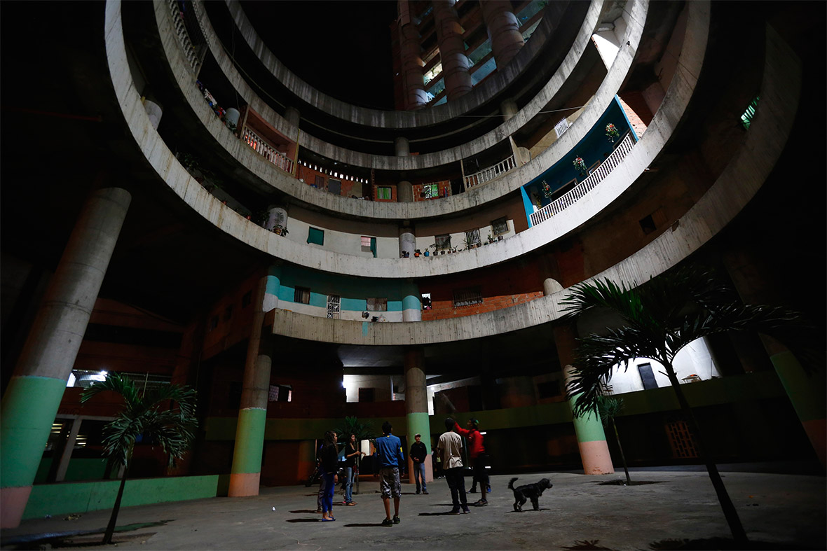 Children play in the lobby of the Tower of David skyscraper in Caracas