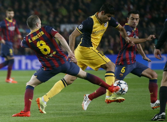 Atletico Madrid's Diego Costa (C) is challenged by Barcelona's Andres Iniesta (L) and Xavi during their Champions League quarter-final first leg soccer match at Camp Nou stadium in Barcelona April 1, 2014. Atletico Madrid's Diego Costa (C) is challenged by Barcelona's Andres Iniesta (L) and Xavi during their Champions League quarter-final first leg soccer match at Camp Nou stadium in Barcelona April 1, 2014.