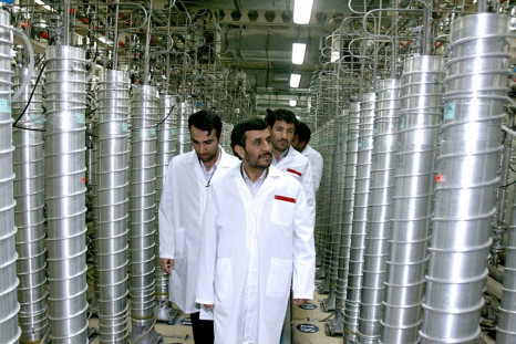 Former Iranian president Mahmoud Ahmedinejad (C) tours the Natanz uranium enrichment facility in 2008.