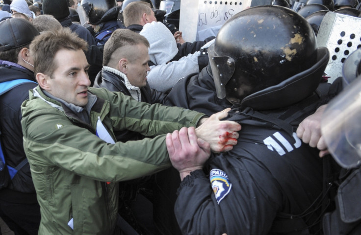 Pro-Russian activists scuffle with police near the regional government building in Donetsk