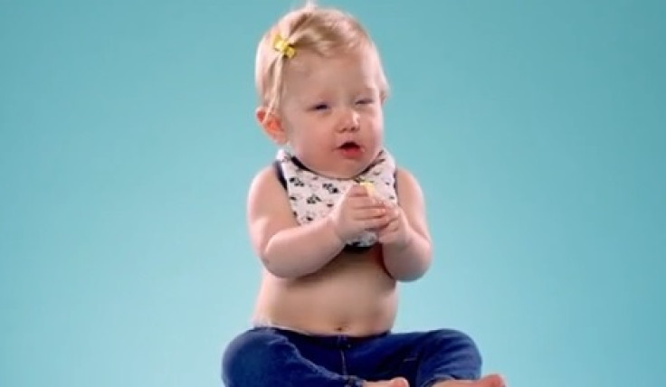 Baby eating lemon