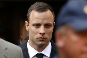 Oscar Pistorius leaves court after speaking for the first time during his trial for killing Reeva Steenkamp