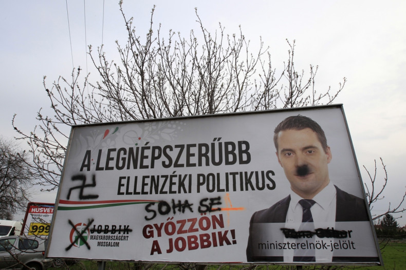 A defaced election poster of far-right Jobbik party leader Gabor Vona is seen in Budapest, April 2, 2014. Hungarians vote in a parliamentary election on Sunday that is set to return Orban into power for another four years and entrench the far-right Jobbik