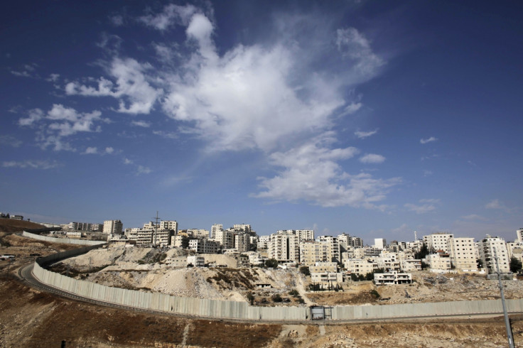 A section of the controversial Israeli barrier runs along the Shuafat refugee camp in the West Bank