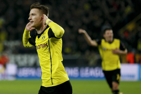 Borussia Dortmund's Marco Reus (L) celebrates after scoring a goal against Real Madrid during their Champions League quarter-final second leg soccer match in Dortmund, April 8, 2014.