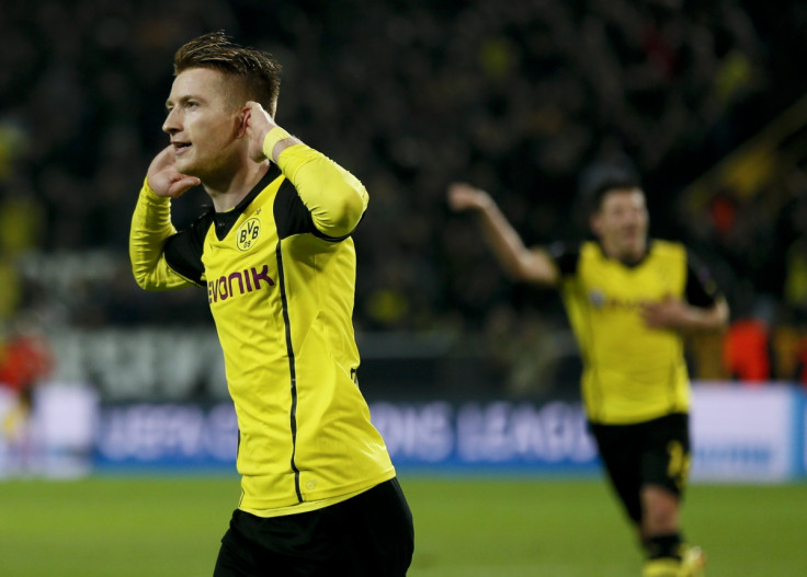 Borussia Dortmund's Marco Reus (L) celebrates after scoring a goal against Real Madrid during their Champions League quarter-final second leg soccer match in Dortmund, April 8, 2014.