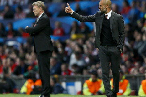 Bayern Munich's coach Pep Guardiola (R) gestures next to Manchester United's manager David Moyes during their Champions League quarter-final first leg soccer match at Old Trafford in Manchester, April 1, 2014.